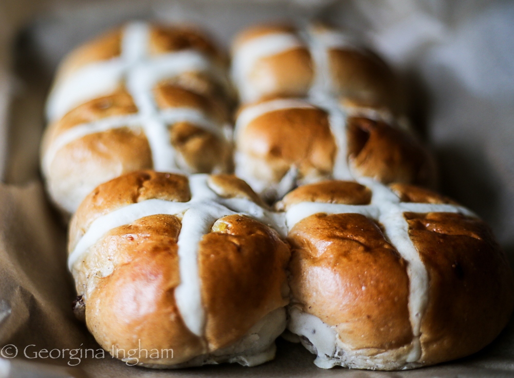 Tray of 6 home baked hot cross buns in rustic style